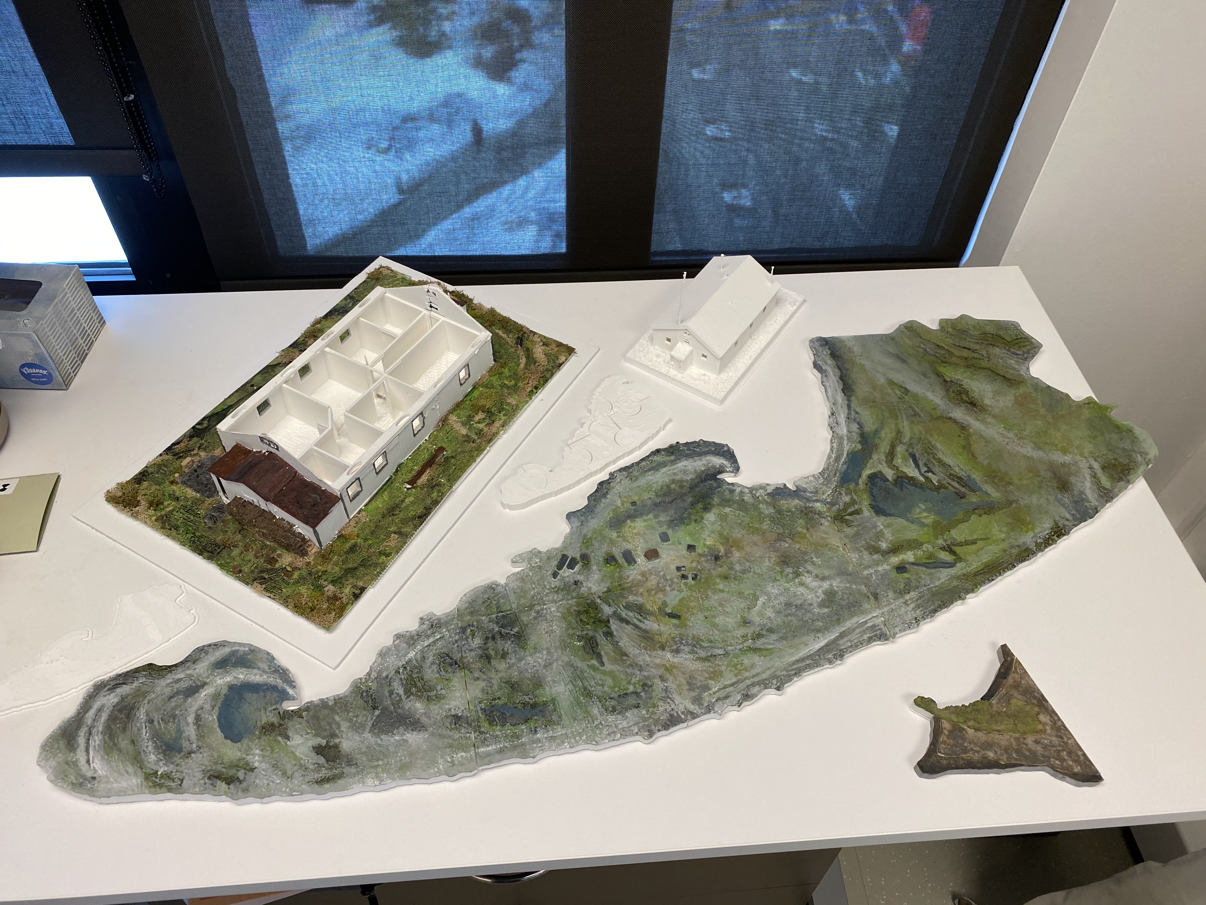 Assorted 3D printed models of the Community House and Pauline Cove, created from TLS and Drone data