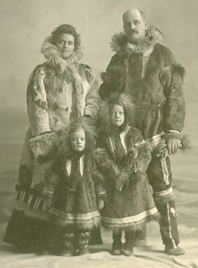 Archbishop I.O. Stringer, Mrs Stringer and their two children in traditional dress at Herschel Island. - 1933. Photo source: Anglican Church of Canada Archives, P7517.